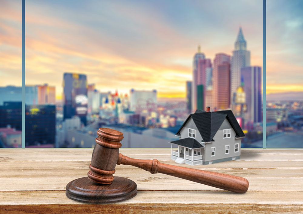Gavel and model home, representing real estate law